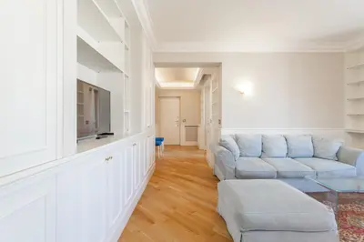 a living room with a couch and a tv at Monteverde 2BDR Penthouse in Rome