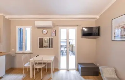 a living room with a table and a dining room at Domus Augustea - 3 Floor in Rome