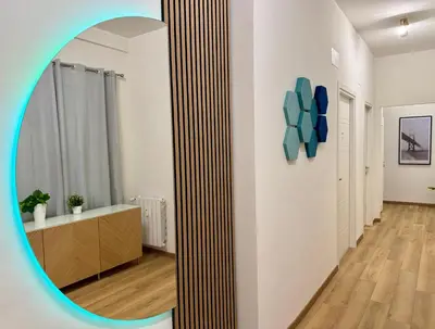 a mirror in a room with a bathroom at Lorena Cozy Rooms - Ospedale Gemelli - WiFi in Rome