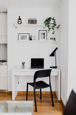 a desk with a chair and a computer on it at Photographer's House in Rome