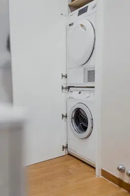 a washer and dryer in a room at Photographer's House in Rome