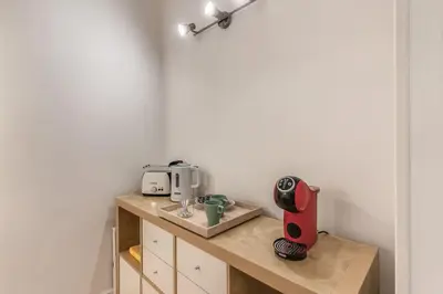a kitchen with a counter with a coffee maker on it at Fresh House San Lorenzo in Rome