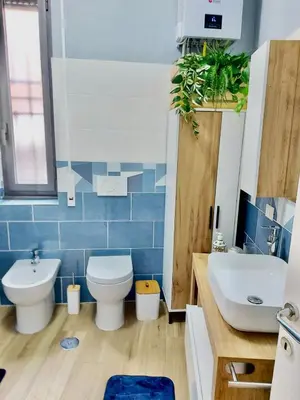 a bathroom with a toilet and a sink at Happy Days \u5feb\u4e50\u7684\u65e5\u5b50 in Rome
