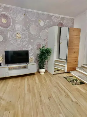 a living room with a flat screen tv on a wall at Happy Days \u5feb\u4e50\u7684\u65e5\u5b50 in Rome