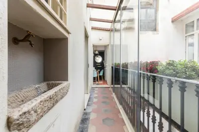 an empty balcony with a person standing in the background at YCH-Colosseo book house in Rome