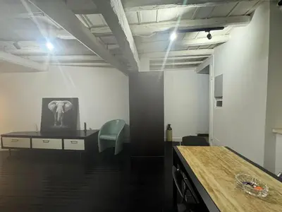 an office with a desk and an elephant picture on the wall at In Ancient Rome Apartment in Rome
