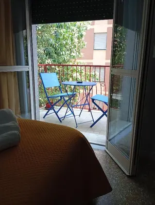 a patio with a table and chairs on a balcony at Giosephine House in Rome