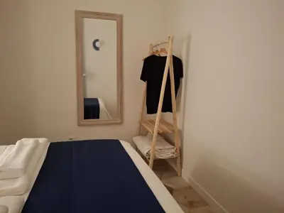 a bedroom with a bed and a mirror at Rare Seed Trastevere in Rome