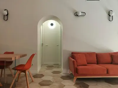 a living room with a couch and a table at Rare Seed Trastevere in Rome