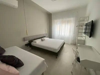 a small room with two beds and a ladder at Casa vacanze Belsito in Rome