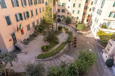 an aerial view of a courtyard with trees and buildings at St Peter Miracle Suite in Rome