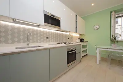 a kitchen with a sink and a stove top oven at YCH-Luminoso appartamento nel cuore di Testaccio in Rome