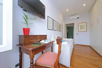 a home office with a desk and a couch at YCH-Luminoso appartamento nel cuore di Testaccio in Rome
