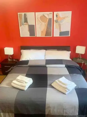 a bedroom with a bed with two towels on it at Lovely apartment near Rome Vatican in Rome