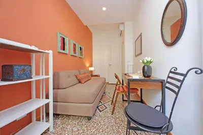 a living room with a couch and a table at YCH-Riboty House al Vaticano in Rome