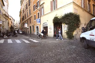 a group of people standing on a cobblestone street at Lovely studio in Campo de Fiori in Rome