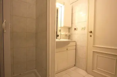 a bathroom with a shower and a sink and a mirror at Lovely studio in Campo de Fiori in Rome