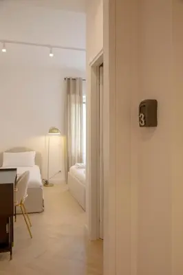 a room with a bedroom with a bed and a desk at San Pietro Luxury Relais in Rome