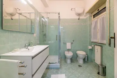 a bathroom with a sink and a toilet and a shower at Inside Rome in Rome