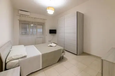 a bedroom with a large bed and a window at Inside Rome in Rome