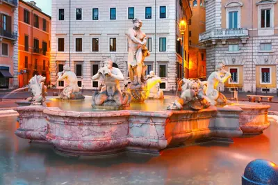 a fountain in the middle of a city at Appartamento Roma Prefetti Suite in Rome