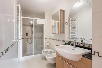 a bathroom with a sink and a toilet and a shower at Charme e Lusso a San Pietro in Rome