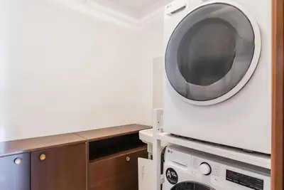 a washing machine and a dryer in a kitchen at Charme e Lusso a San Pietro in Rome