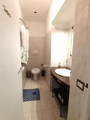 a bathroom with a sink and a toilet at san giovanni - re di roma apartment in Rome