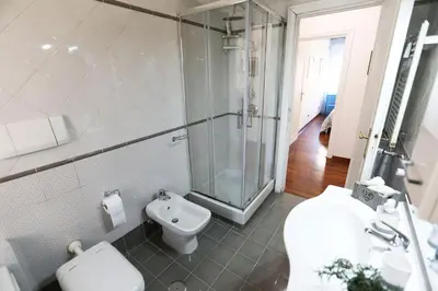 a bathroom with a shower and a toilet and a sink at Flaminio center house in Rome