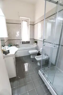 a bathroom with a toilet and a sink and a shower at Flaminio center house in Rome