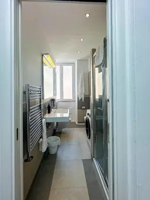 a bathroom with a sink and a toilet at Lilla Boutique Apartment in Rome
