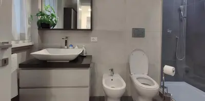 a bathroom with a toilet and a sink at Casetta Cerquetti, a Monteverde in Rome