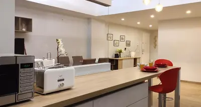 a kitchen with a counter top with a microwave at Casetta Cerquetti, a Monteverde in Rome