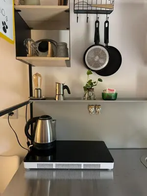 a kitchen counter with a coffee pot on top of it at Urban Oasis in Rome