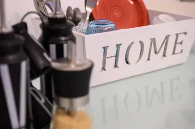 a sign that says home home made next to a container with scissors at Triple room a few steps from Tiber in Rome