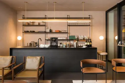 a bar in a restaurant with chairs and a counter at master Trevi in Rome