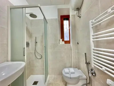 a bathroom with a shower and a toilet and a sink at Giuli-Etta a Testaccio in Rome