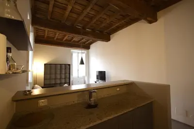 a kitchen with a sink and a counter top at Cartari Holiday House in Campo de Fiori in Rome