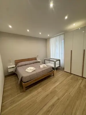 a bedroom with a bed with two towels on it at Dimora Appia in Rome