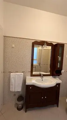 a bathroom with a sink and a mirror at Vatican suite Rhome in Rome