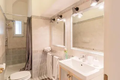 a bathroom with a sink and a toilet and a shower at La Bella Vita - Trastevere in Rome