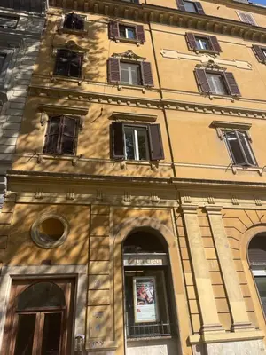 a tall building with many windows on it at Casa Sara in Rome