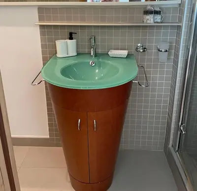 a bathroom with a green sink and a shower at Mary St Peter Vatican Loft in Rome