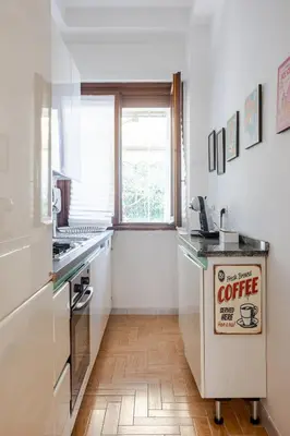 a kitchen with a coffee sign on a counter at Fleming hill apartments - Free Private Parking & Garden in Rome