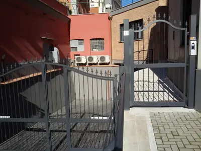an iron gate in front of a building at FantAflat in Rome