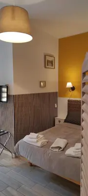a bedroom with a bed with two towels on it at FantAflat in Rome