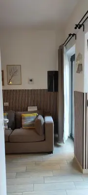 a living room with a brown couch in a room at FantAflat in Rome