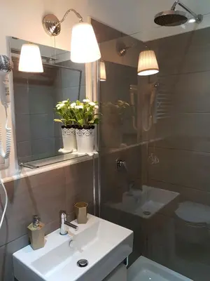 a bathroom with a sink and a mirror at FantAflat in Rome