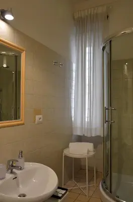 a bathroom with a sink and a shower at Nobilcasa Suites in Rome
