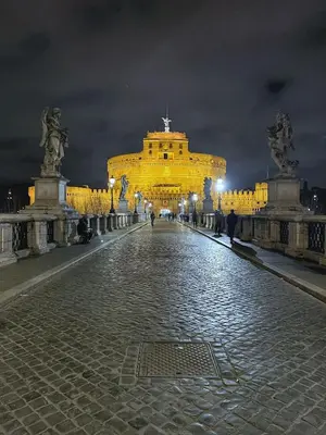 a large building is lit up at night at Domus Dolce Vita - Apartment in Rome